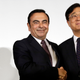 Nissan Motor Co. President and CEO Carlos Ghosn, left, and Mitsubishi Motors Corp. Chairman and CEO Osamu Masuko pose for photographers after their joint press conference at the Nissan headquarters in Yokohama, near Tokyo, Thursday, May 12, 2016. Photo credit AP